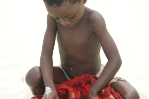A Swahili Child Picking Up Crabs During a Low Tide, Zanzibar